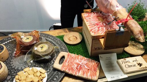 Around the sides of the room, suppliers from the two regions had set up stalls, displaying their products. So, as well as the tapas that was brought out on the trays, we had a whole load of other goodies to try out like this jamón and cheese from Granada.