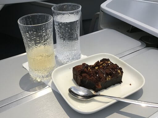 Decadent chocolate dessert, washed down with champers on our Finnair A350 Business Class flight to Helsinki